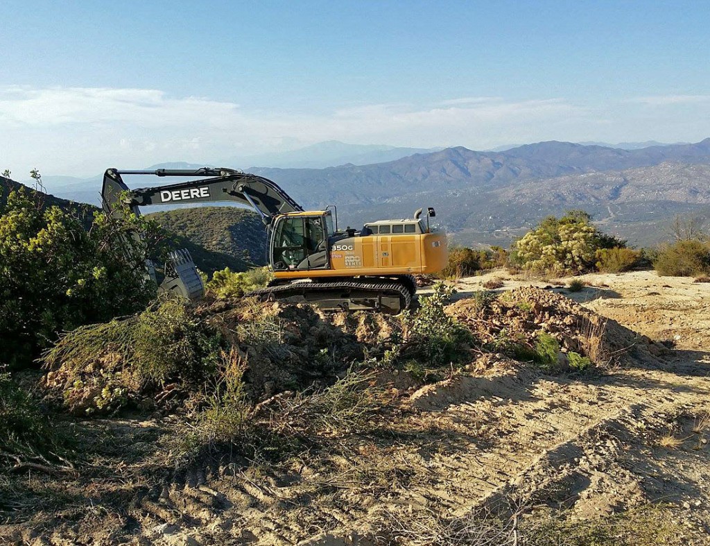 Mtn Lily first day road and expose pegs 4 Deere Begins Pegmatite Exposure photo image